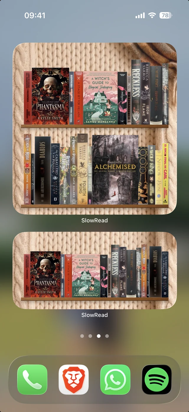 An iPhone home screen with two SlowRead widgets, each showing a shelf of book spines